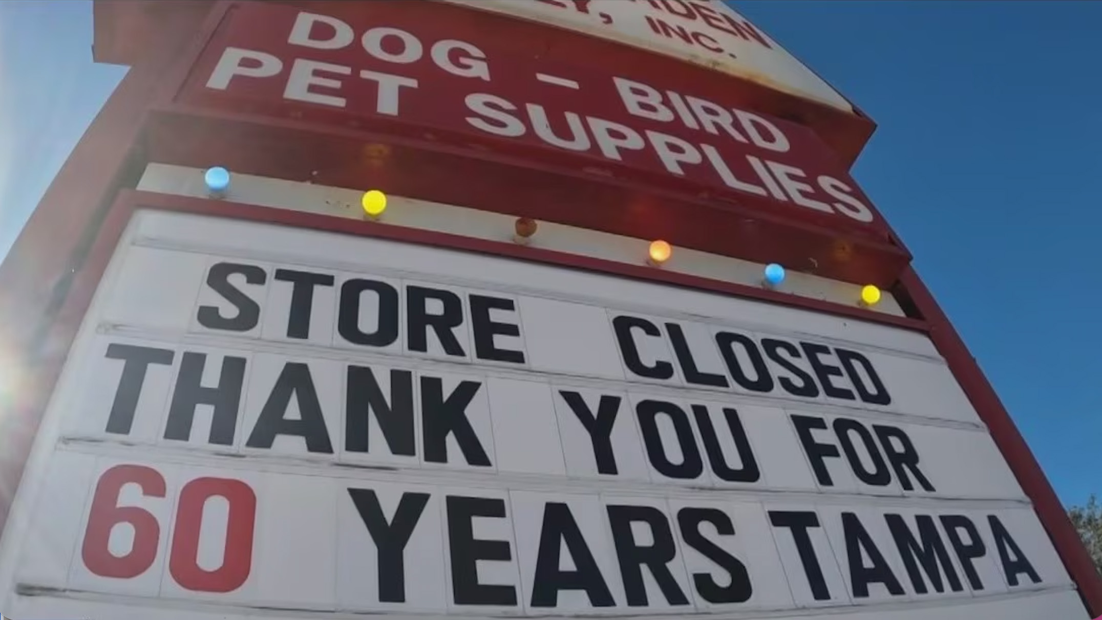 Main street storefront with a going-out-of-business sign